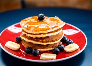 baked pancake with blueberry and slice of banan