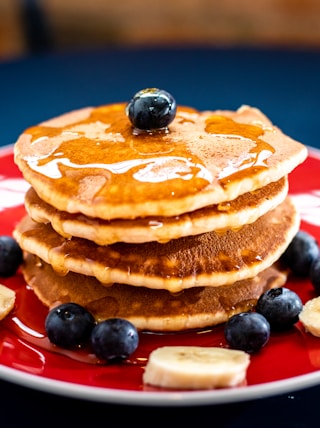 baked pancake with blueberry and slice of banan