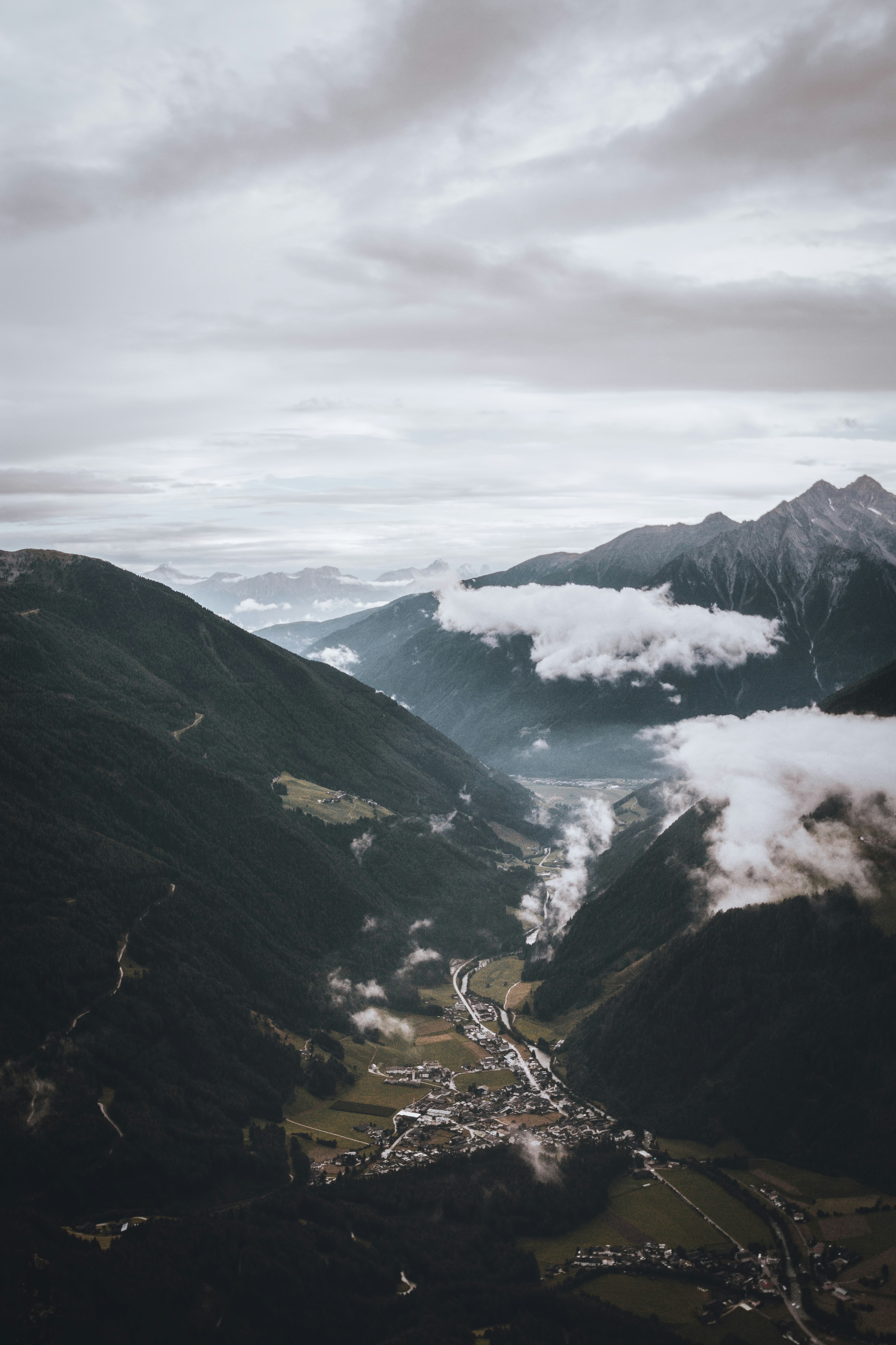 bird's eye view of city surrounded by mountains