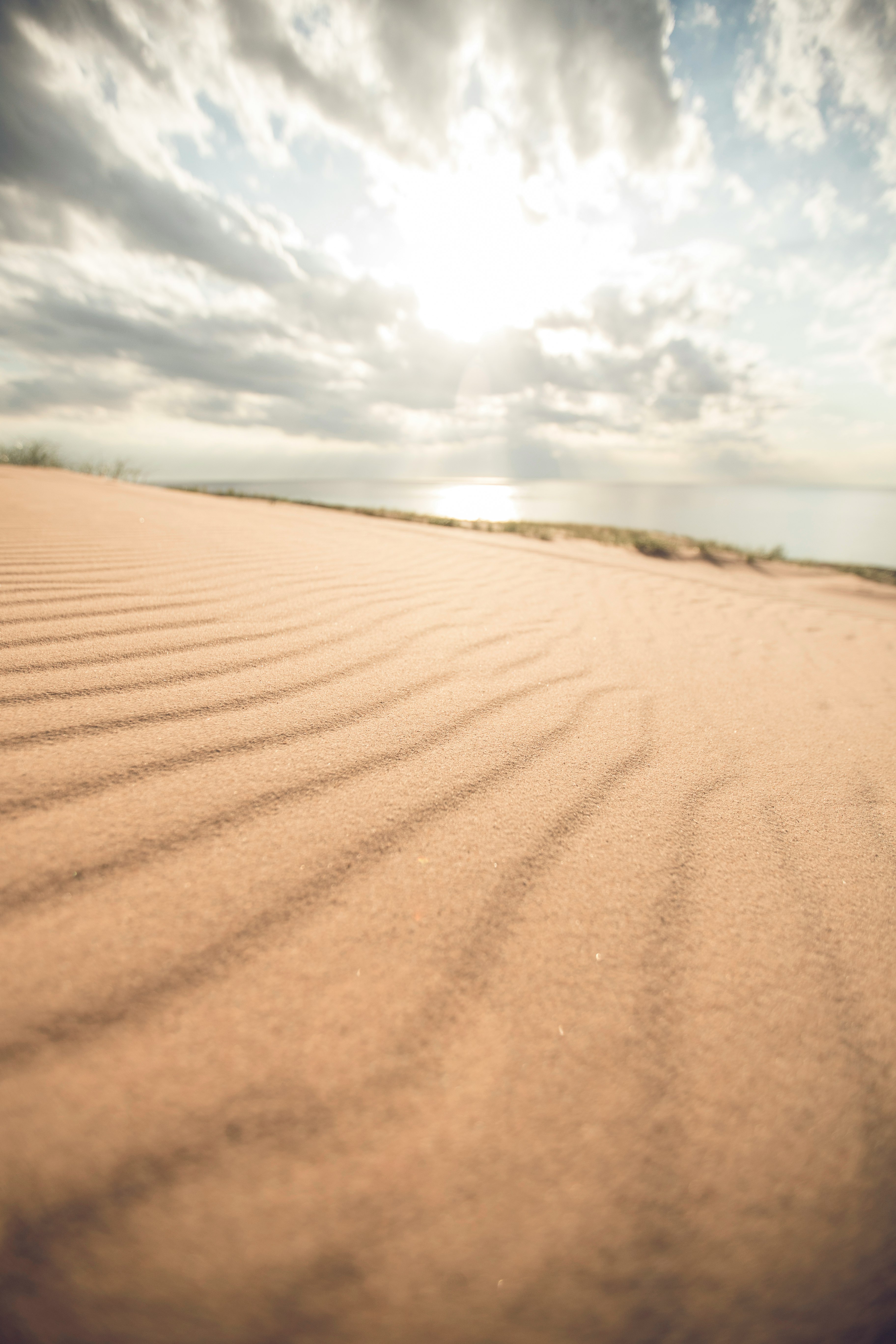 landscape photography of brown soil near body of water