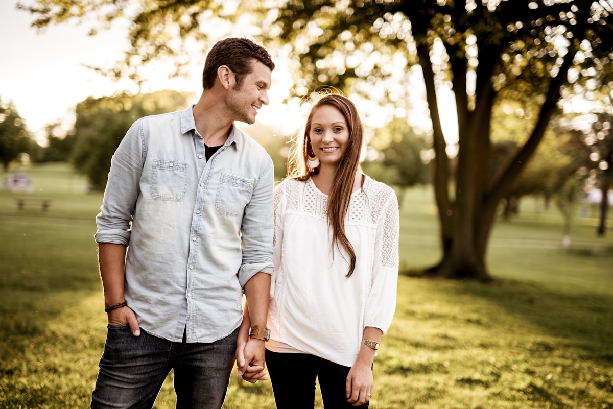 A couple holding hands on a quiet walk