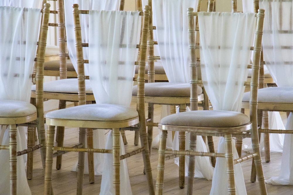 person showing brown bamboo-themed chairs