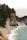 body of water beside rock formations