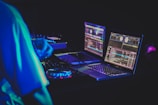 two laptop computers and DJ turntables