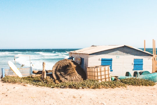 white IBC beside house during daytime in Taghazout Morocco