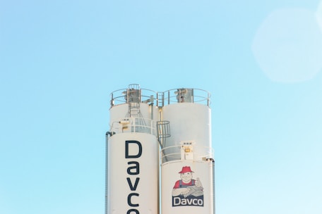 Close-up of a cement silo with clear branding, ready for shipment across the U.S.