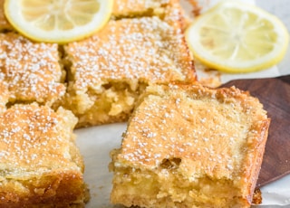 a lemon cake with slices cut out of it