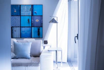 A sparkling clean apartment living room with fresh light blue accents.