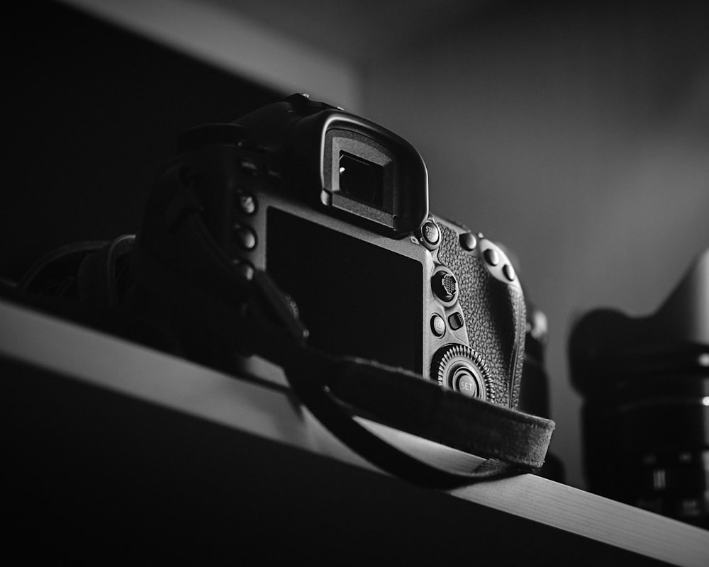 DSLR camera on top of shelf