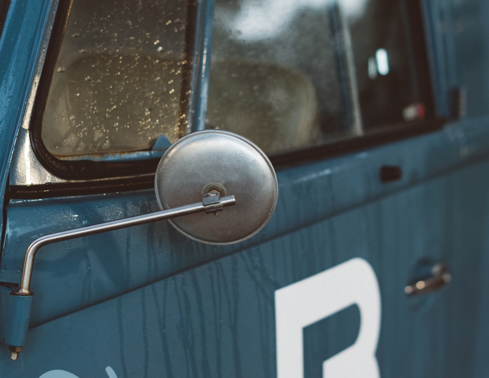 gray vehicle side mirror in closeup shot