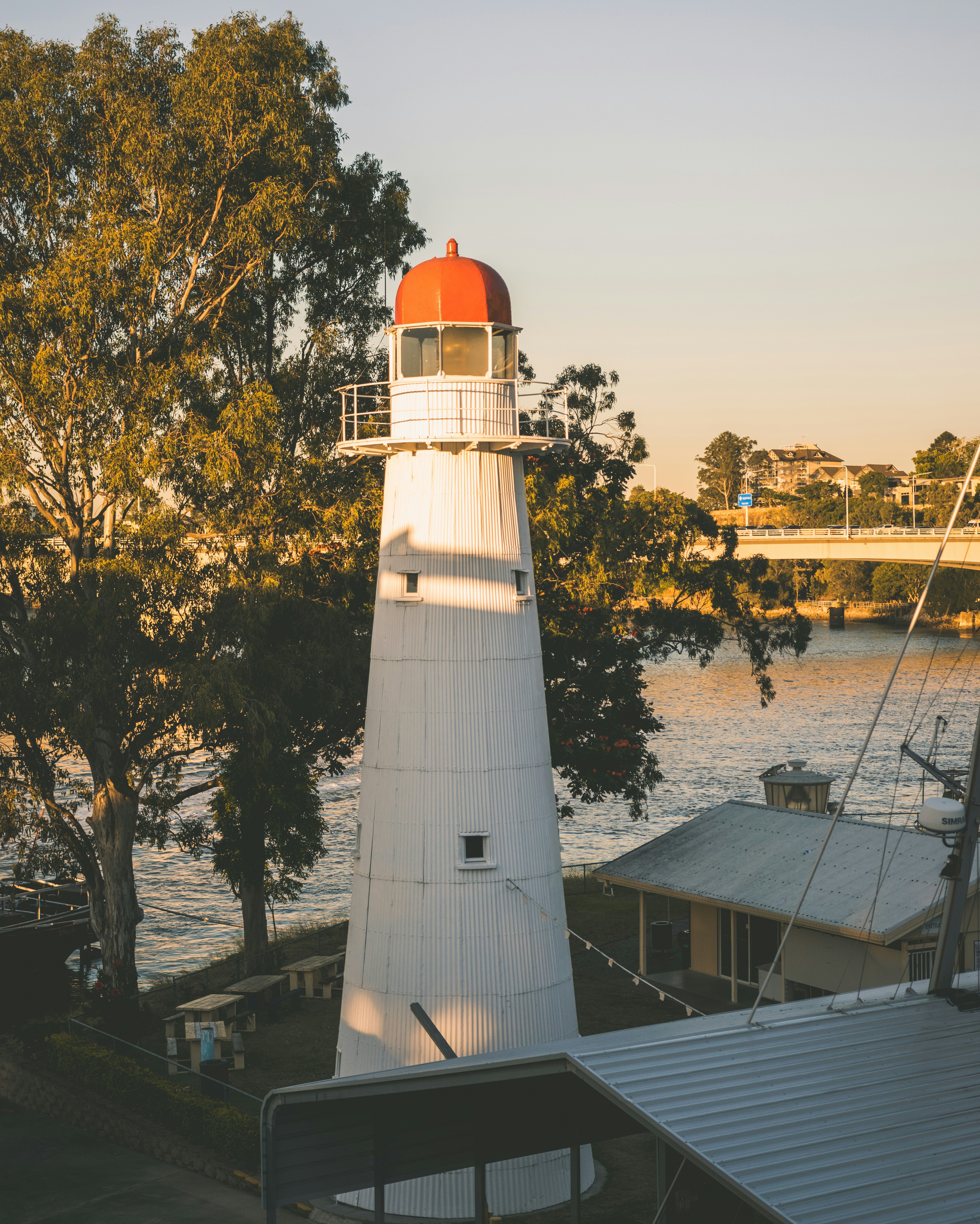 lighthouse beside house during daytime
