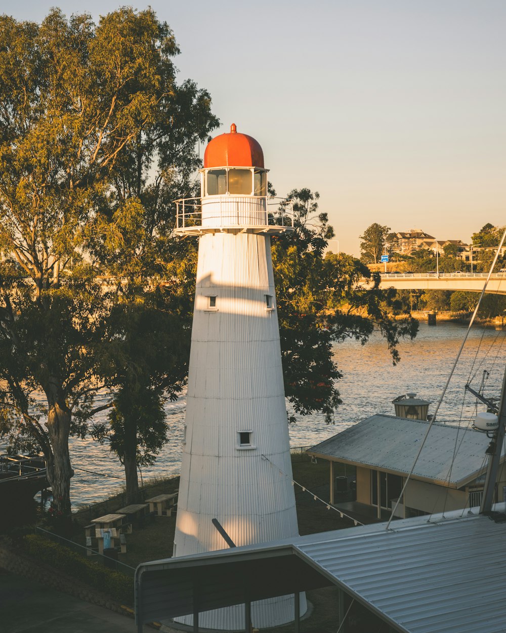 lighthouse beside house during daytime