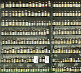 assorted labeled bottle on display shelf