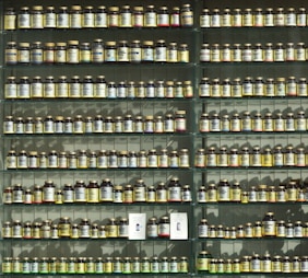 assorted labeled bottle on display shelf