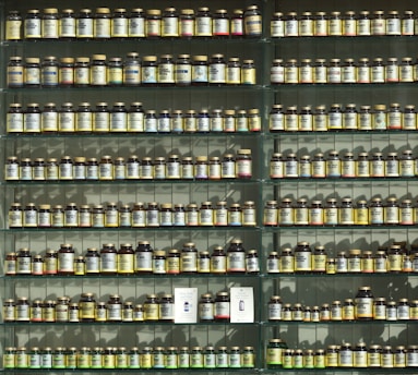 assorted labeled bottle on display shelf