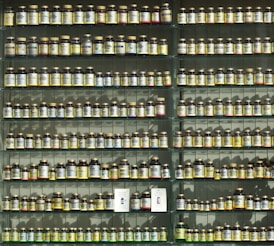 assorted labeled bottle on display shelf