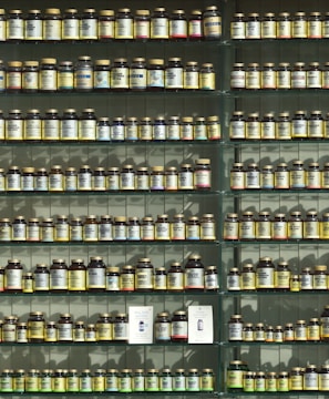 assorted labeled bottle on display shelf