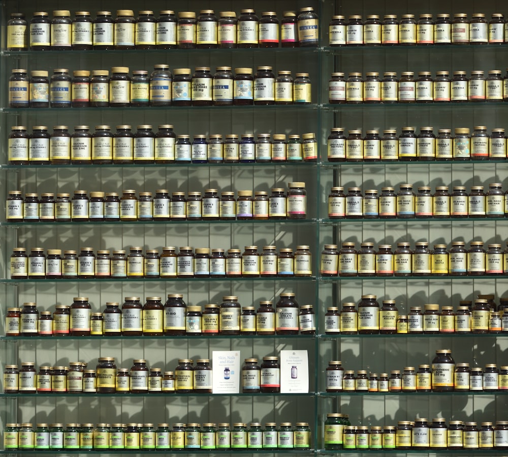 assorted labeled bottle on display shelf