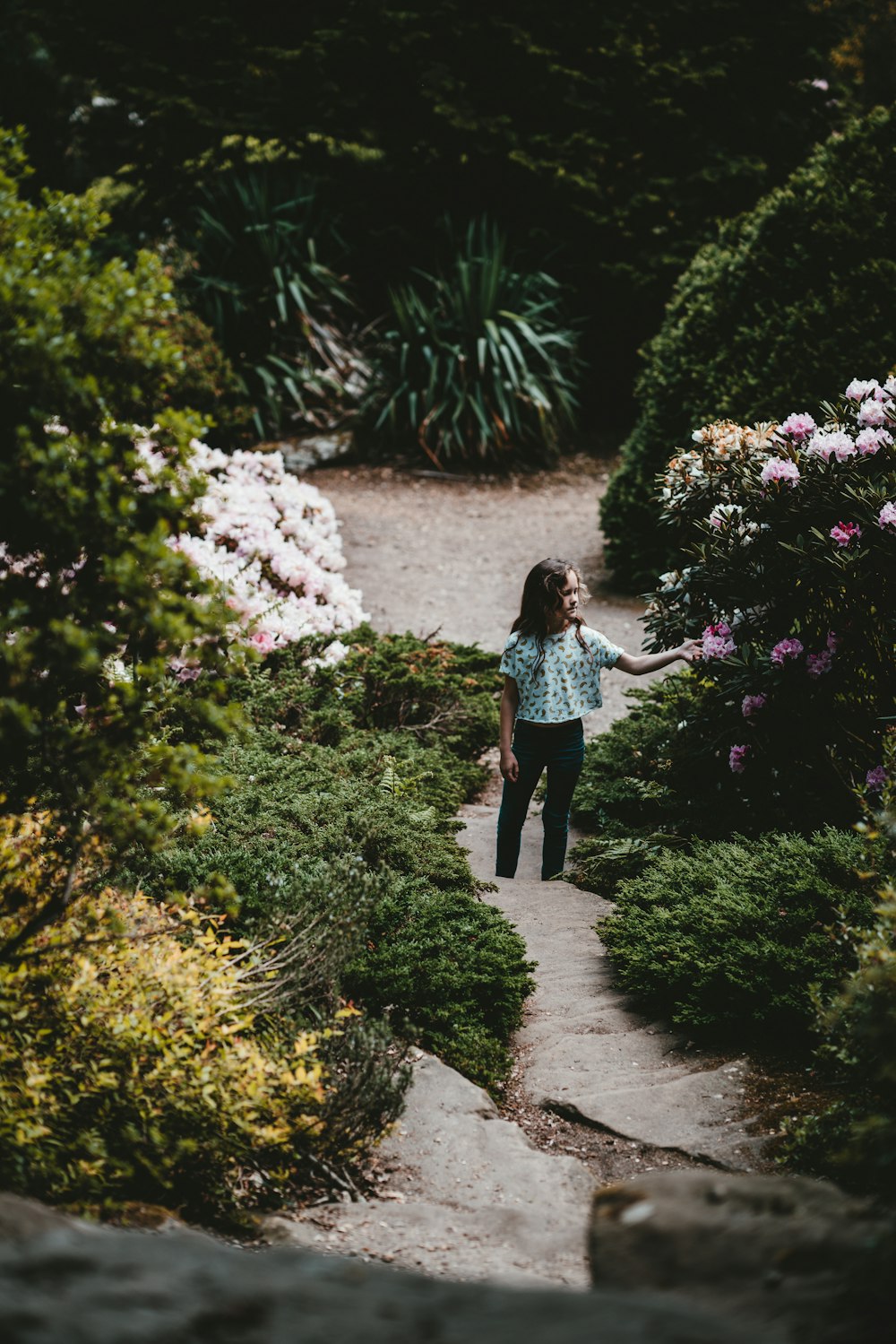 girl picking flower