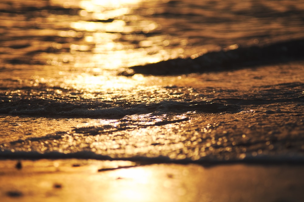 a close up of a wave on a beach