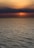body of water during sunset
