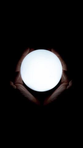 A serene image of a person gently holding a glowing, layered orb symbolizing the hidden layers of healing.