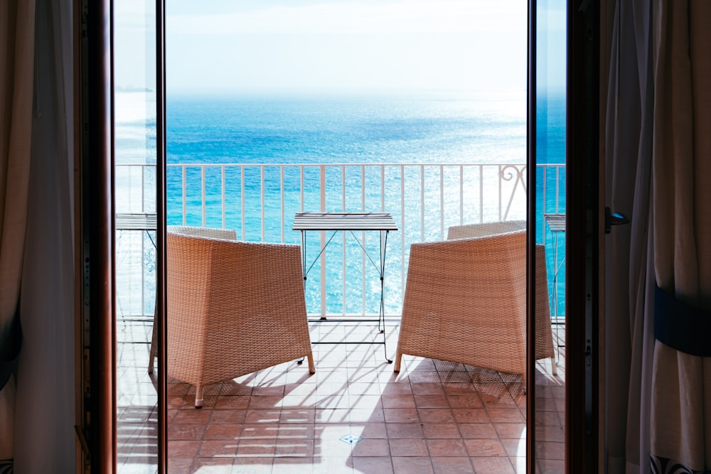 two wicker chair near fence