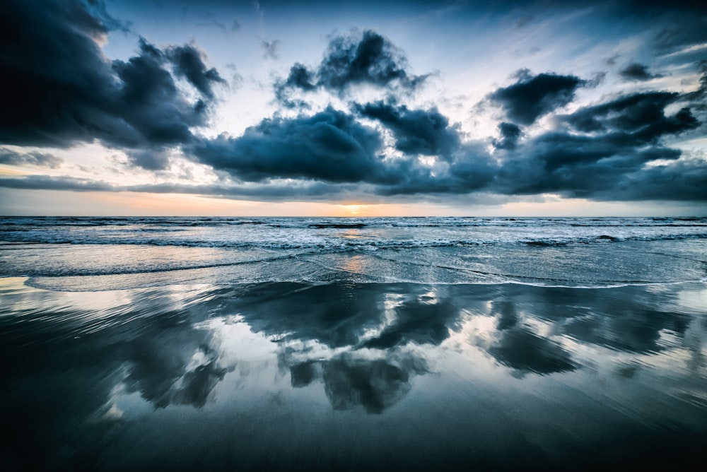 photo of seawaters and gray clouds