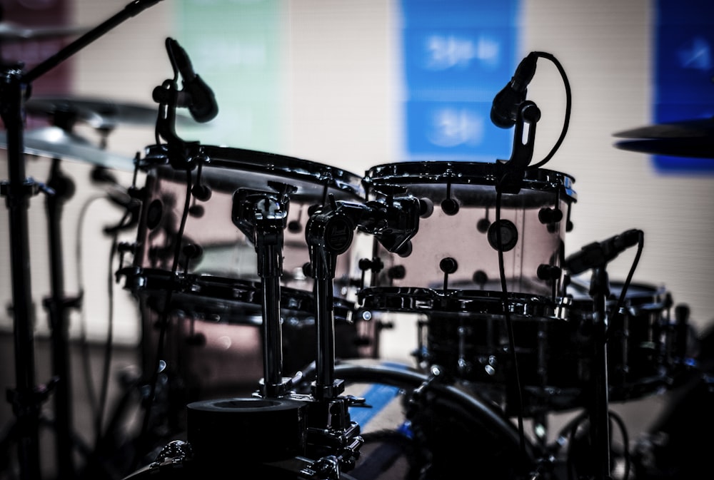black drum set shallow focus photography