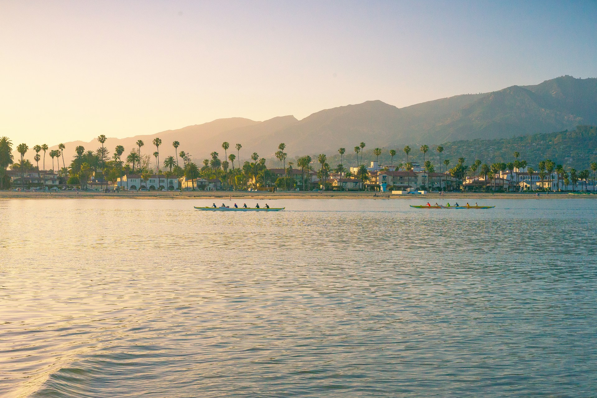 people riding boat on body of water during daytime