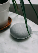 round charcoal Google Home Mini plug-in