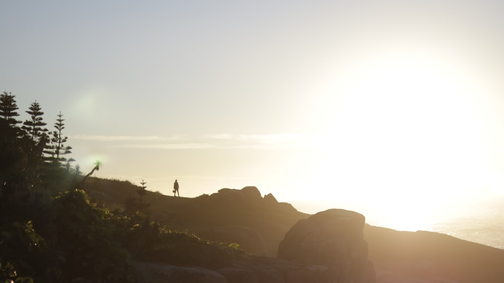 silhouette of person on mountain