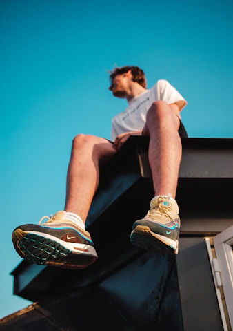 person sitting on top of a roof