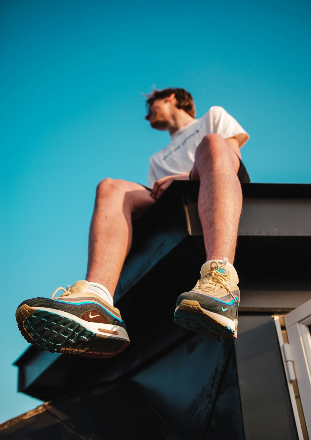 person sitting on top of a roof