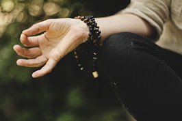 person doing meditation outdoors