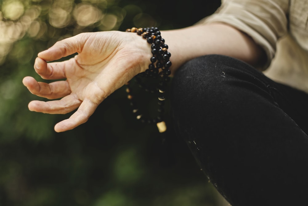 person doing meditation outdoors