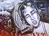 A black and white mural depicts a person with closed eyes singing passionately into a microphone. The person wears headphones and has light-colored hair. The background includes a crowd of people, suggesting a concert or performance setting. The image is artistically stylized, creating a dramatic and energetic atmosphere.