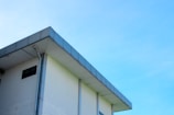 A modern commercial building with a sleek, newly installed flat roof.