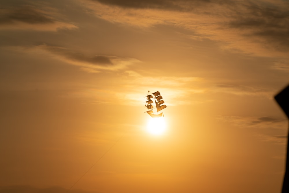 ship under white clouds digital wallpaper