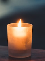 tea light on brown surface