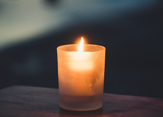 tea light on brown surface