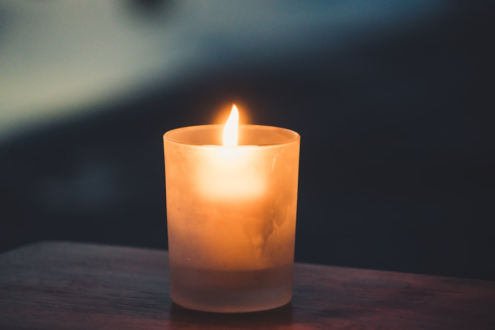 tea light on brown surface