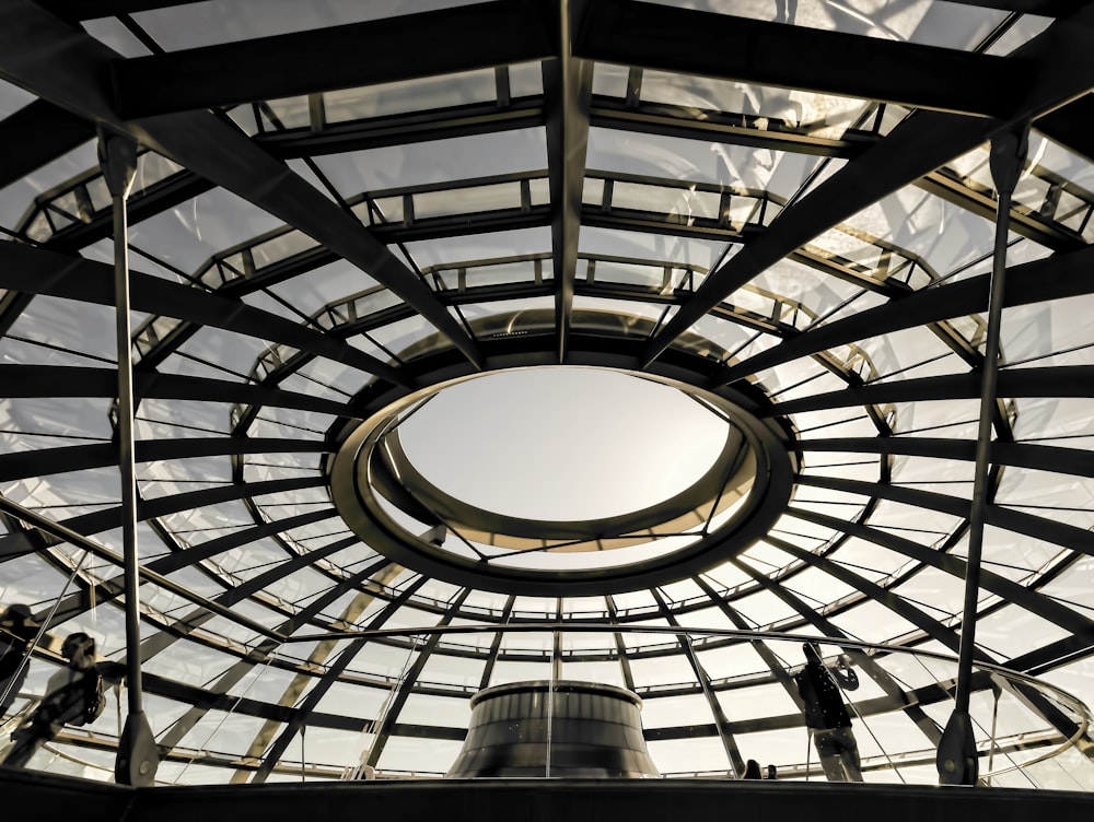 people standing under clear glass ceiling