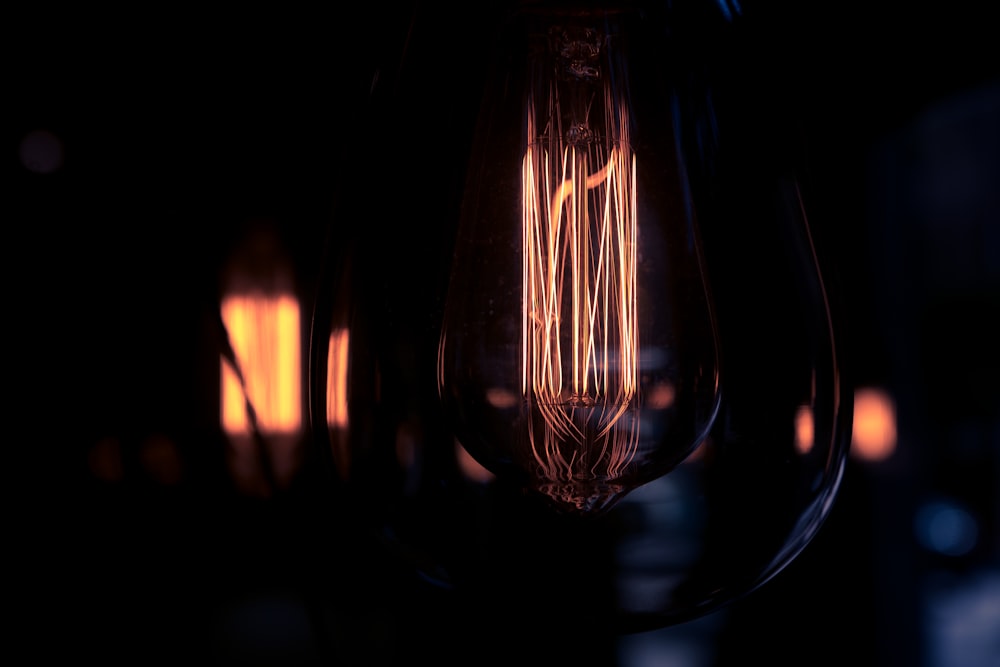 a close up of a light bulb in the dark