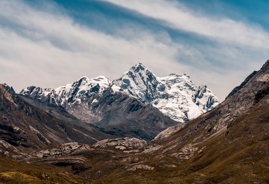 black mountain covered by snow in Huascarán National Park Peru