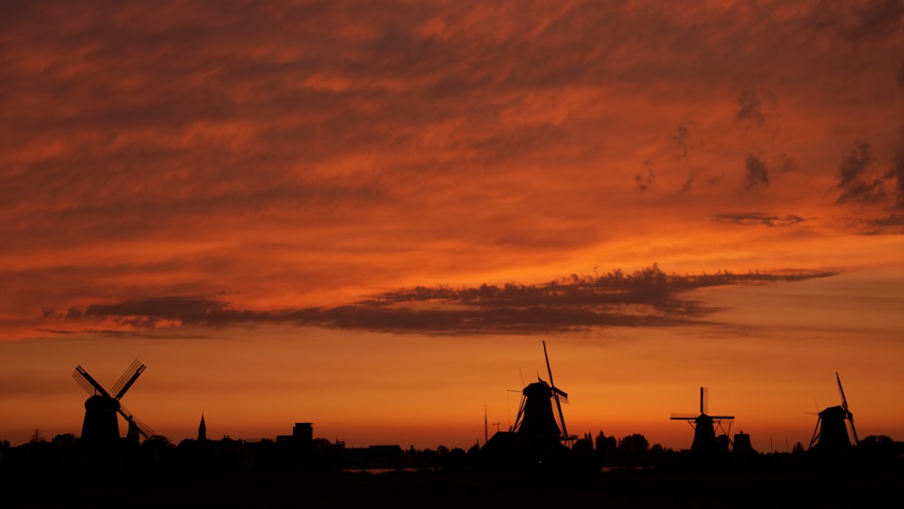 windmill silhouette during golden house