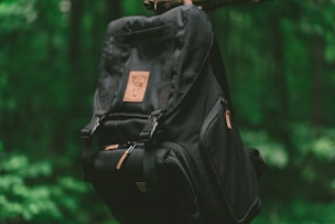 hanging black and brown backpack