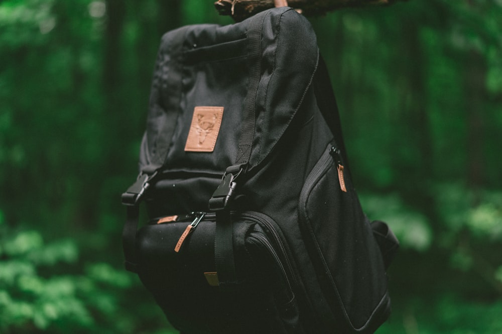 hanging black and brown backpack