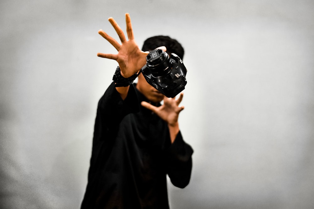 man wearing black shirt with virtual reality headset