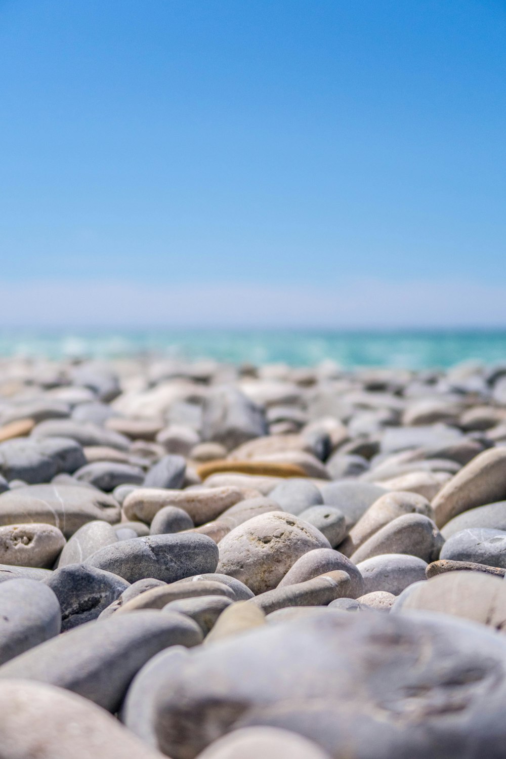 gray pebbles near body of water